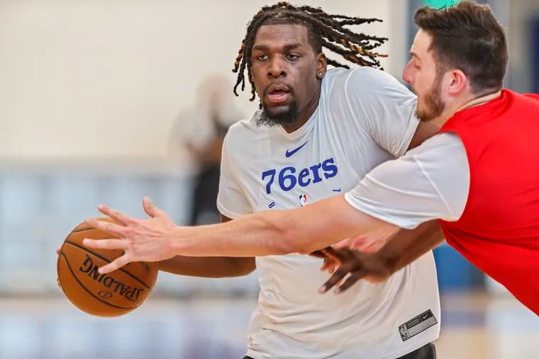 Naz Reid (left) brings the ball up the court during a scrimmage at the Sixers predraft workout.