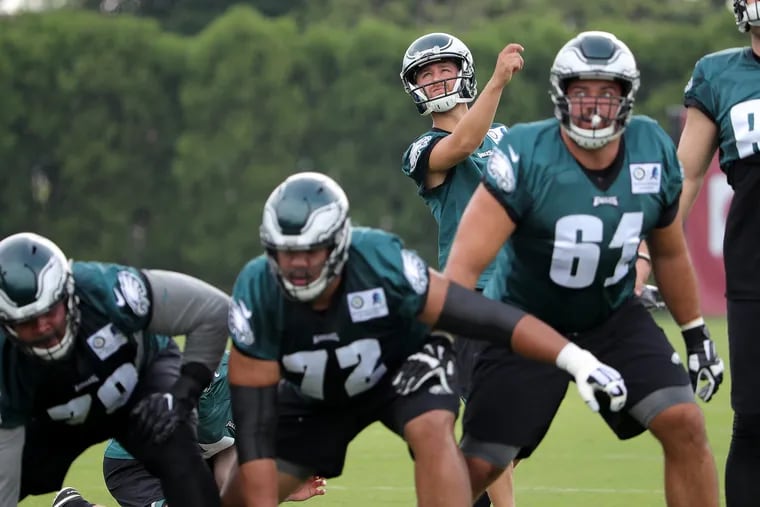 Eagles kicker Jake Elliott, right, watches his field goal attempt during the Philadelphia Eagles training camp at the NovaCare Complex on July 27, 2018 in Philadelphia, PA. DAVID MAIALETTI / Staff Photographer