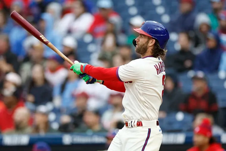 Phillies Bryce Harper watches his second-inning solo home run Saturday against the Mets.