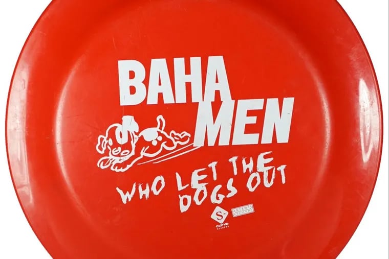 A “Who Let the Dogs Out” Frisbee, part of the exhibit.