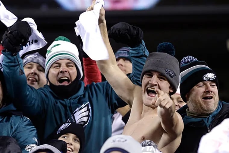 Eagles fans cheer during the first half of an NFL wild-card playoff football game against the New Orleans Saints, Saturday, Jan. 4, 2014, in Philadelphia. (Julio Cortez/AP)