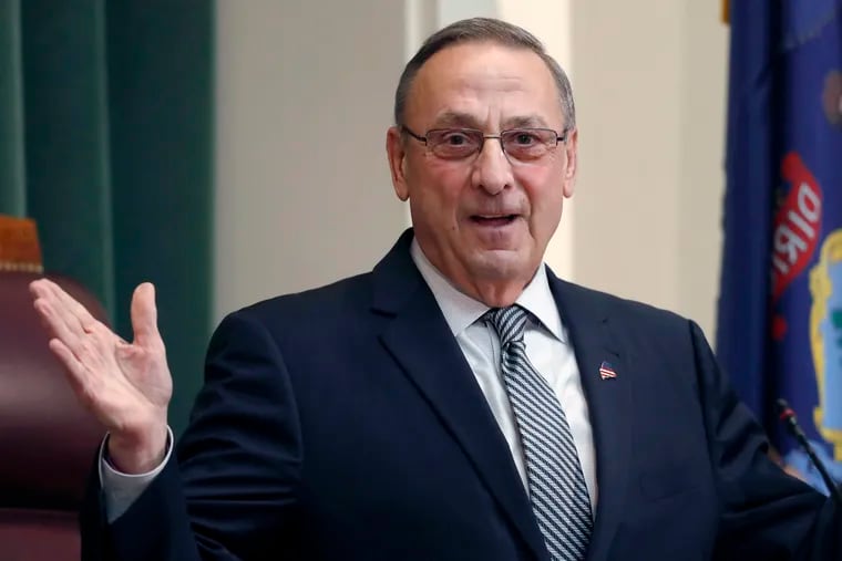 FILE - In this Feb. 13, 2018, file photo, Gov. Paul LePage delivers the State of the State address to the Legislature at the State House in Augusta, Maine. Maine’s corrections department says that the former governor pardoned two people in his last days in office without consulting the clemency board and holding a public hearing. (AP Photo/Robert F. Bukaty, File)