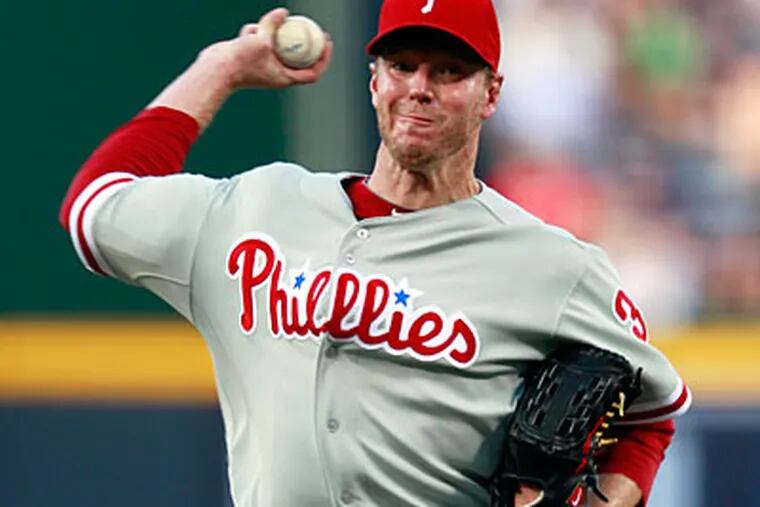 Roy Halladay made his decision to depart from the Phillies before Tuesday's 15-13 loss. (John Bazemore/AP Photo)