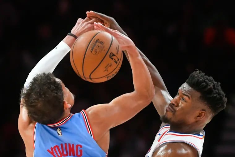 Jimmy Butler (left) defends against Atlanta's Trae Young during the second half Wednesday night.