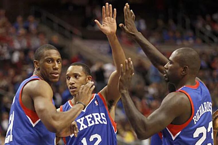 Sixers' Thaddeus Young, Evan Turner and Jason Richardson celebrate
Turner's first quarter basket against the Denver Nuggets on Wednesday,
October 31, 2012.  (Yong Kim / Staff Photographer)