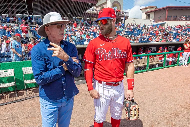 Philadelphia Phillies, Bryce Harper and former player, Mike Schmidt interact minute before facing the Toronto Blue Jays, at BayCare Ballpark in Clearwater, Florida, March 19, 2022.