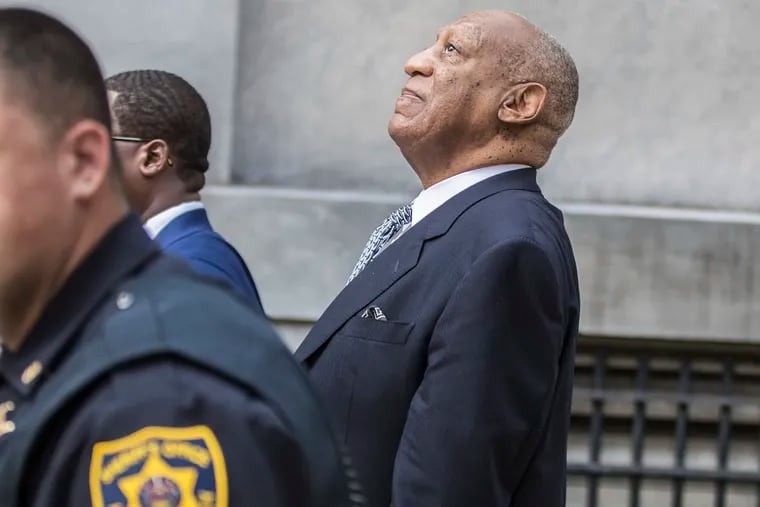 Bill Cosby leans back to hear words of encouragement from onlookers outside the Montgomery County Courthouse Tuesday, August 22, 2017 after attending a court hearing pertaining to his new trial in 2018.