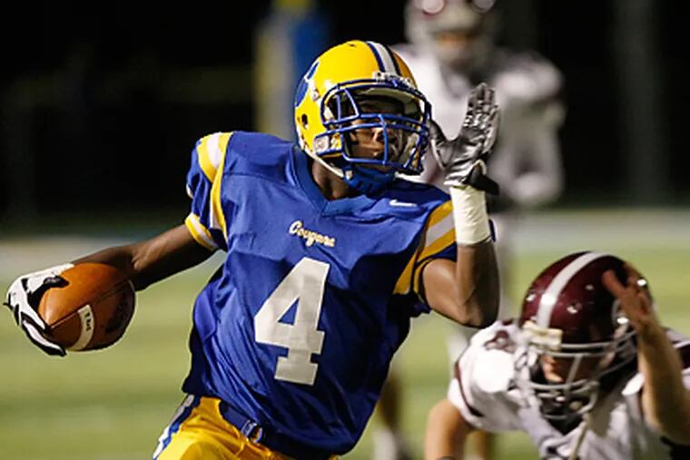 Downingtown East's Jay Harris returns a punt for 54 yards to set up a field goal. (Michael S. Wirtz / Staff Photographer)