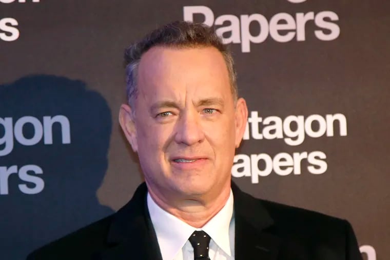 FILE - In this Jan. 13, 2018, file photo, actor Tom Hanks poses for photographers on arrival at the French premiere of the film "The Post" in Paris, France. Hanks recently surprised a New Mexico woman celebrating her birthday at an Albuquerque, N.M., restaurant by singing "Happy Birthday" to her.