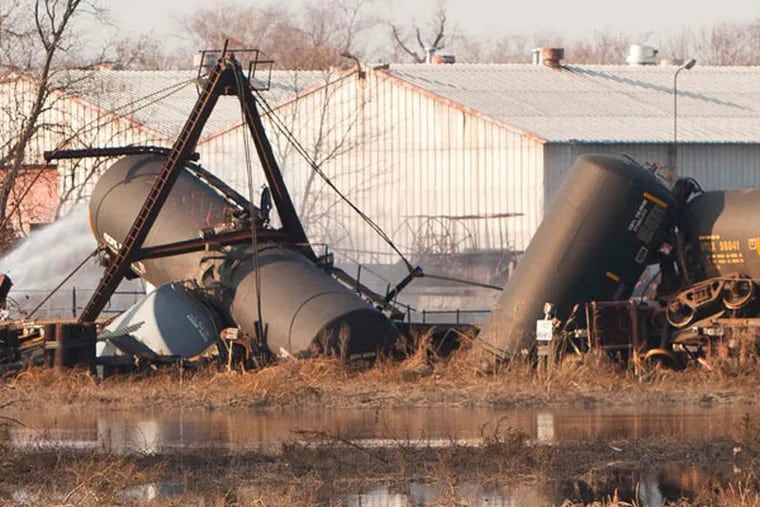 The blocks surrounding the Paulsboro train derailment were evacuated and public schools were ordered closed in December 2012 because of spiking levels of vinyl chloride in the air. (Ryan S. Greenberg / Staff Photographer)