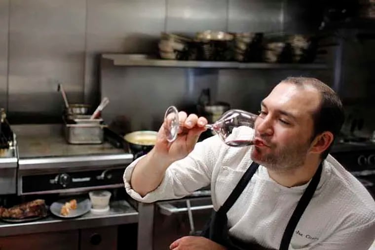 Chef Joe Cicala pauses at Le Virtu in Philadelphia for a sip of wine during a nine-hour dining marathon.
