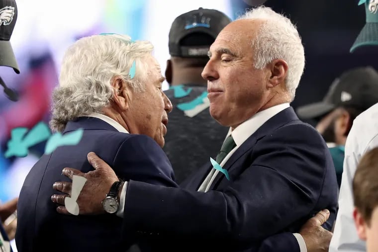 Patriots owner Robert Kraft, left, talks with Eagles owner Jeffrey Lurie after the trophy ceremony after Super Bowl LII, at U.S. Bank Stadium in Minneapolis, Minnesota, Sunday, Feb. 4, 2018. The Eagles won 41-33. TIM TAI / Staff Photographer 
