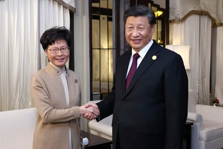President Xi Jinping with Hong Kong chief executive Carrie Lam in Shanghai, China. Beijing’s attitude toward the protests makes this an international issue.