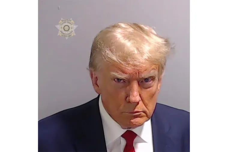 This booking photo provided by Fulton County Sheriff's Office, shows former President Donald Trump on Thursday, Aug. 24, 2023, after he surrendered and was booked at the Fulton County Jail in Atlanta. Trump is accused by District Attorney Fani Willis of scheming to subvert the will of Georgia voters in a desperate bid to keep Joe Biden out of the White House.