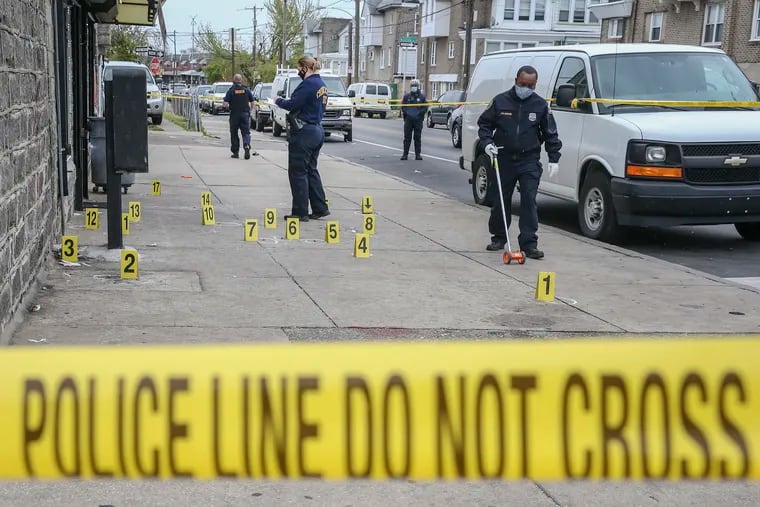 Philadelphia Police investigate a homicide at 65th Street and Dicks Avenue in Elmwood on Thursday.