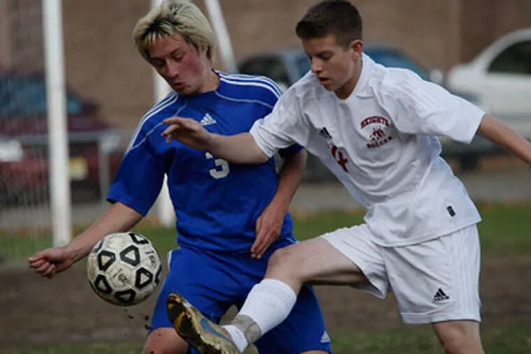 Gateway's Chris Norris (left) and Haddon Heights' Jake Roselle (right) go after the ball. Gateway plays Haddon Heights in the South Jersey boys' soccer semifinals on November 12, 2012. ( Michael S. Wirtz / Staff Photographer )