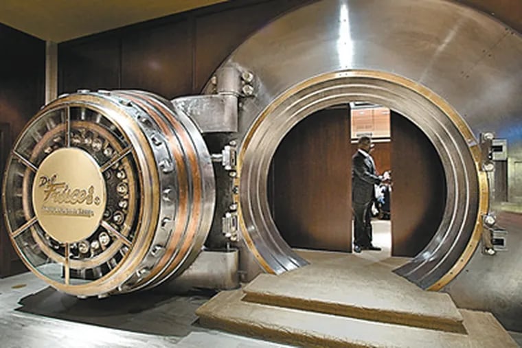 A party in the basement bank vault at Del Frisco's, 15th and Chestnut Streets. (David M. Warren / Staff Photographer)