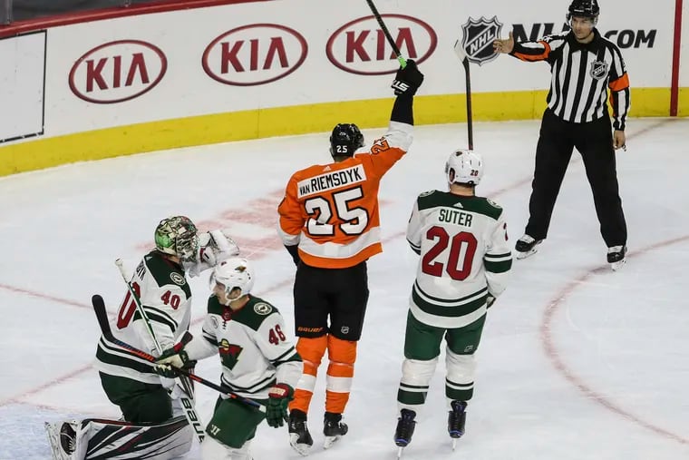 James van Riemsdyk celebrates after deflecting in a shot from Jake Voracek in the first period of the Flyers' win Monday over the Wild.