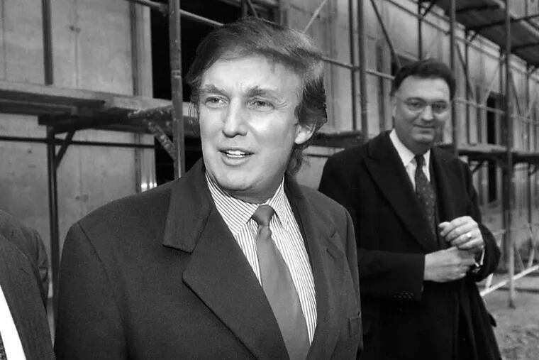 FILE - In this Nov. 5, 1996 file photo, American real estate mogul Donald Trump, left, checks out sites in Moscow, Russia, for luxury residential towers. Trump's decades-long dream of building a luxury tower in the heart of Moscow flared and fizzled several times over the years, most recently when his presidential campaign was gaining momentum. That latest plan led his former lawyer Michael Cohen to plead guilty to a charge of lying to congressional investigators about key details in the negotiations, most notably that those talks stretched far deeper into the 2016 campaign than previously thought. (AP Photo/Igor Tabakov, File)
