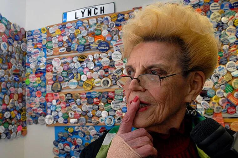 Former City Commission Chairwoman Marge Tartaglione in her Philadelphia office, standing in front of a wall of campaign buttons collected over the years. ( APRIL SAUL / Staff file photo )