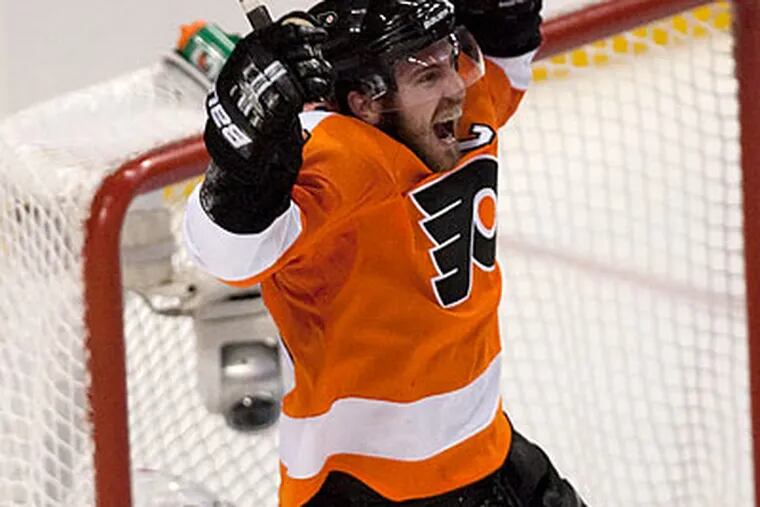 Mike Richards celebrates after sealing the Flyers' win with an empty-net goal. (Ed Hille/Staff Photographer)