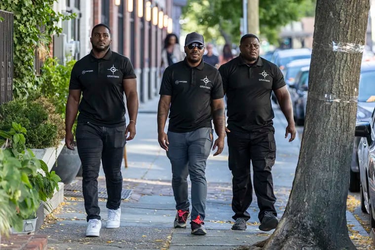(From left to right) Justice, 24, Griff, 30, and Barry, 40, Safety Ambassadors for Fishtown Kensington Area Business Improvement District Headquarters, walking around Fishtown patrolling the area in Philadelphia, Pa., Wednesday, Sept., 21, 2022.