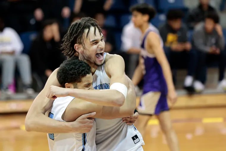 Westtown’s Dereck Lively (right) hugs teammate Quin Berger after the Westtown vs. Perkiomen School PAISAA boys basketball state championship game at La Salle’s Tom Gola Arena in Phila., Pa. on March 5, 2022.