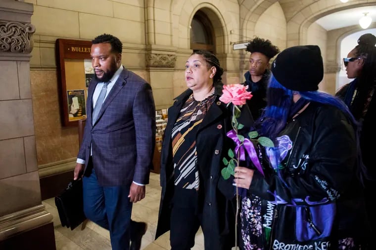 Rose family attorney S. Lee Merritt (left) and Michelle Kenney, center, mother of Antwon Rose II, walk toward members of the media following the closing arguments in the homicide trial of former East Pittsburgh Police officer Michael Rosfeld, Friday, March 22, 2019. at the Allegheny County Courthouse in Pittsburgh. (Nate Smallwood / Pittsburgh Tribune-Review via AP, Pool)
