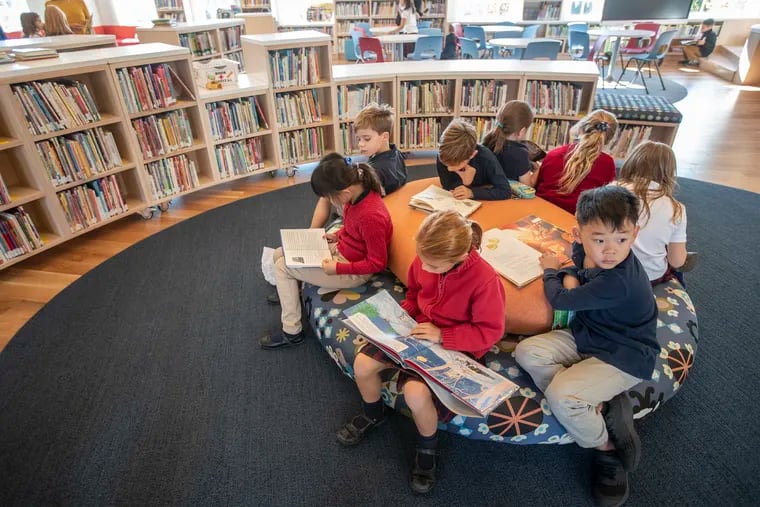 Lower school students congregate at the soft oval reading area which is part of the new $1.5 million, A to Z Library and Learning Commons, at Germantown Academy.  The New York-based architecture firm that designed it incorporated elements from students' designs.