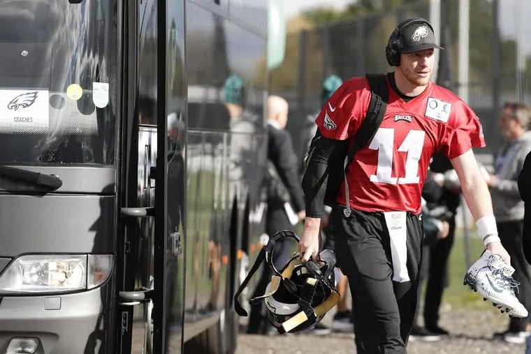 Eagles quarterback Carson Wentz leaves the team bus before the start of practice at the London Irish training ground in Southwest London on Friday, October 26, 2018. YONG KIM / Staff Photographer