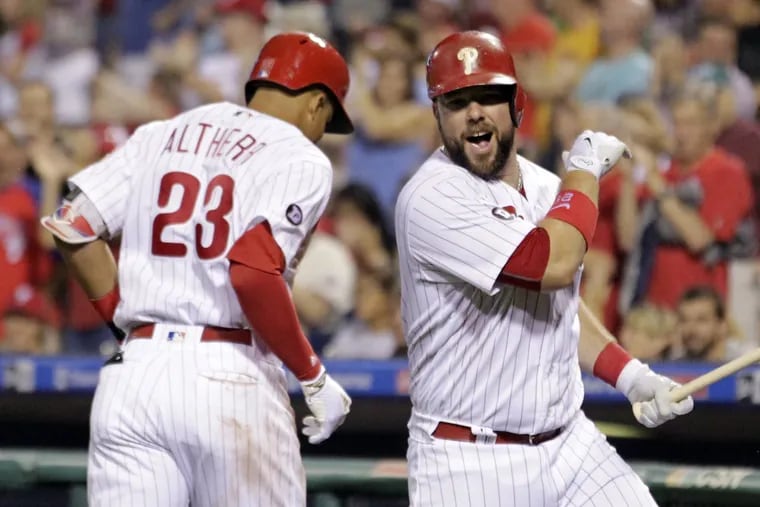 Phillies outfielder Aaron Altherr (left) celebrates with Cameron Rupp after Altherr’s solo homer during the fifth inning of Friday’s 10-3 win over the Braves.