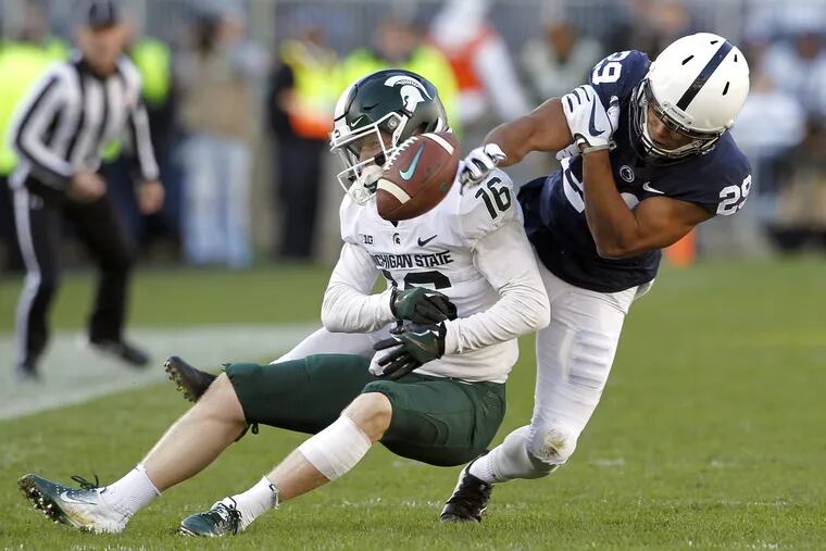 Penn State's John Reid breaks up a pass intended for Michigan State's Brandon Sowards on Saturday.