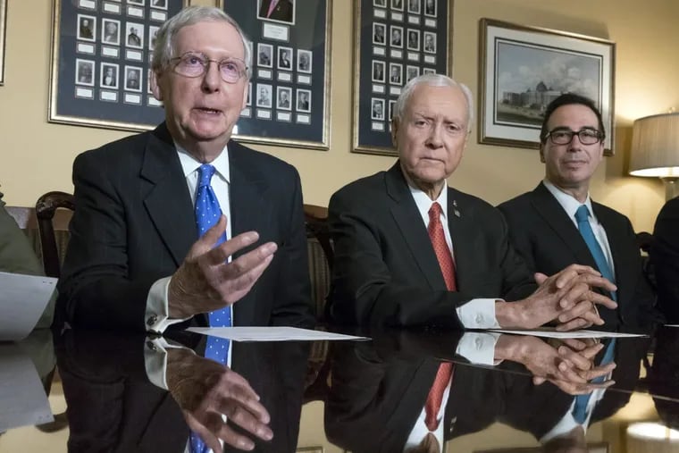 Discussing the Senate’s version of tax reform last week were (from left) Majority Leader Mitch McConnell (R., Ky.), Senate Finance Committee Chairman Orrin Hatch (R., Utah), and Treasury Secretary Steven Mnuchin.