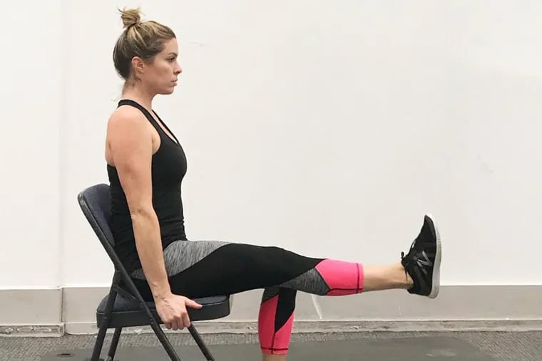 Ashley demonstrates a seated leg extension.