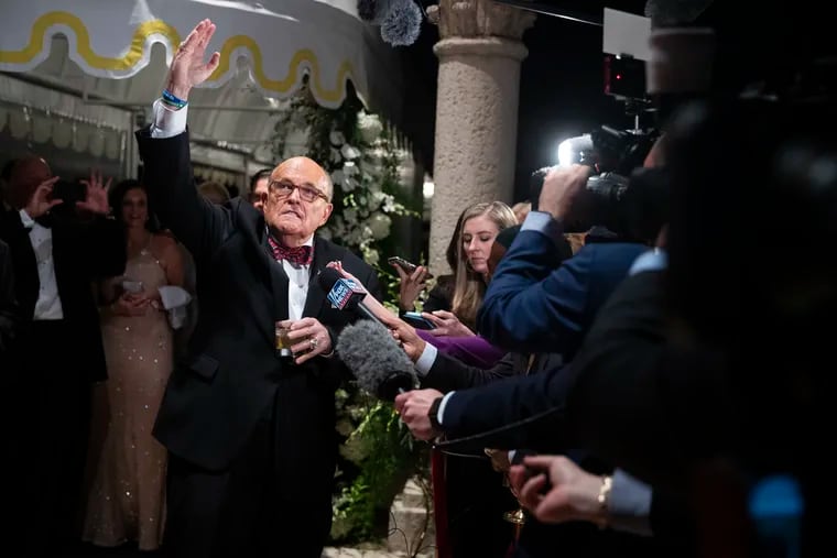 Former New York Mayor Rudy Giuliani, an attorney for President Donald Trump, speaks to reporters as he arrives for a New Year's Eve party hosted by President Donald Trump at his Mar-a-Lago property, Tuesday, Dec. 31, 2019, in Palm Beach, Fla.