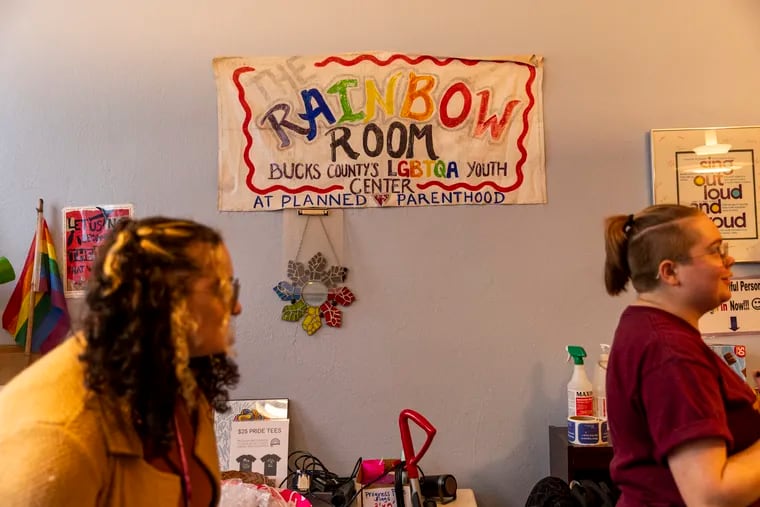 Stel Nemtsov, 23, of Southampton, Pa., substitute teacher at Tamanend Middle School (left), and Tabby Ford, 22, of Cheltenham, Pa., Intern at the Rainbow Room (right), get ready before the Cosmic Colors Queer Prom Oct., 8, 2022.