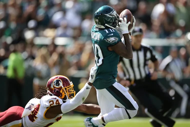 Eagles wide receiver DeSean Jackson (10) makes a touchdown with Washington Redskins cornerback Josh Norman (24) holding on during the second quarter of the game at Lincoln Financial Field in South Philadelphia on Sunday, Sept. 8, 2019.
