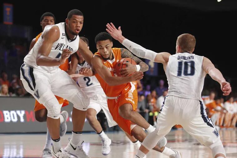 Tennessee guard Lamonte Turner (1) drives to the basket while guarded by Villanova forward Omari Spellman (14) and guard Donte DiVincenzo (10) during an NCAA college basketball game Thursday, Nov. 23, 2017, in the Battle 4 Atlantis tournament in Paradise Island, Bahamas. (Tim Aylen/Bahamas Visual Services Photo via AP)