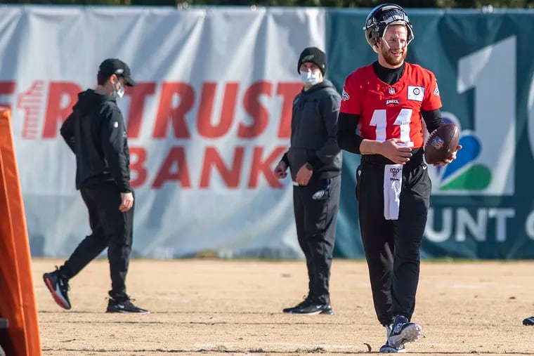 Eagles quarterback Carson Wentz holding the ball during a December practice at the team’s training facility.