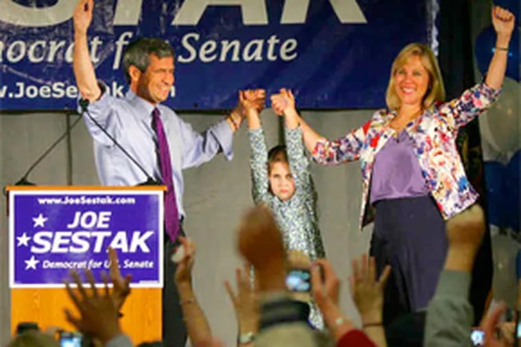 A triumphant Rep. Joe Sestak celebrates with daughter Alex and wife Susan. He called his victory "a win for the people." (David Swanson / Staff Photographer)