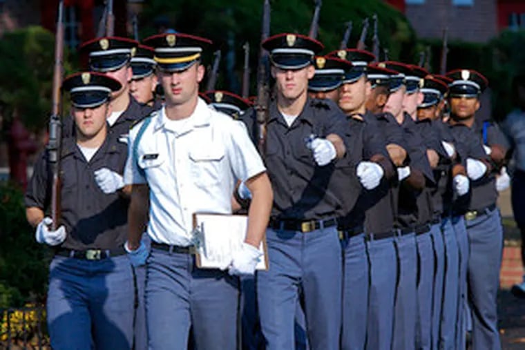 Students drill at Valley Forge Military Academy and College, where the first civilian president took over in 2005. Enrollment is down to 482, and the school had a deficit of $953,214 at the end of fiscal 2006.