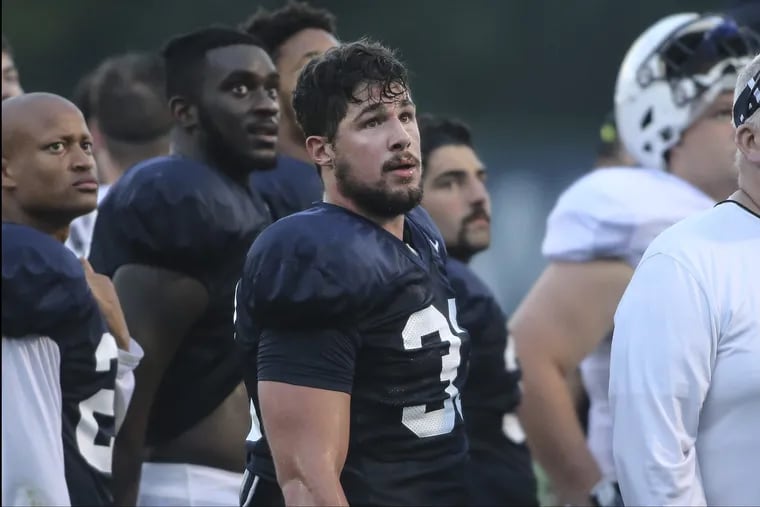Penn State linebacker Jake Cooper, middle, has played just 13 games in the last two seasons because of injuries.