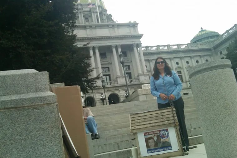 In 2010, Tamira Thayne, chained herself to a doghouse outside the state Capitol in Harrisburg to push for a bill limiting when dogs can be kept on a chain.