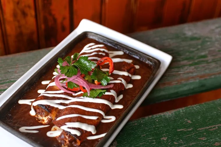 Short-rib-stuffed enchiladas in an intriguing mole at El Poquito.