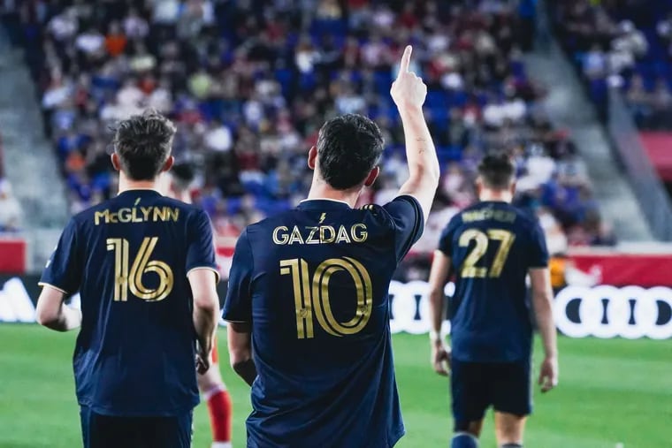 Dániel Gazdag (center) gives a shoutout to the traveling Union fans after scoring his penalty kick goal during the first half.