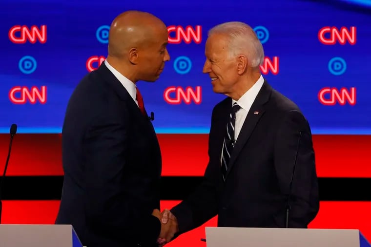 Sen. Cory Booker, D-N.J., shakes hands with former Vice President Joe Biden after the second of two Democratic presidential primary debates hosted by CNN Wednesday, July 31, 2019, in the Fox Theatre in Detroit. (AP Photo/Paul Sancya)