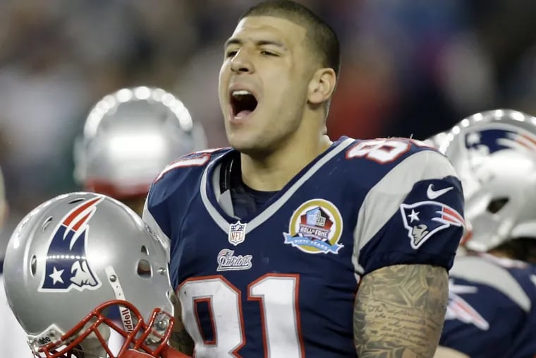 Former New England Patriots tight end Aaron Hernandez reacts during the second quarter of an NFL football game against the Houston Texans in Foxborough, Mass. Hernandez committed suicide in April 2017.