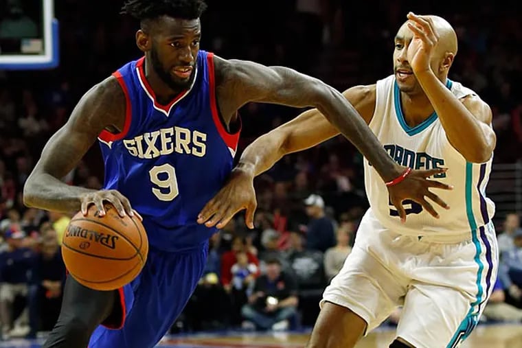 The Sixers' JaKarr Sampson dribbles the ball against the Hornets' Gerald Henderson. (Yong Kim/Staff Photographer)