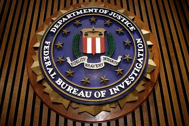 The seal of the FBI hangs at the bureau's Washington headquarters in this file photo.