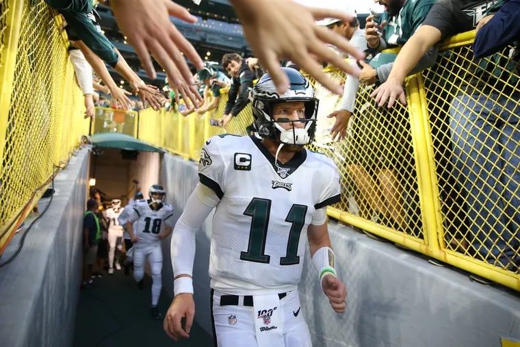 Eagles quarterback Carson Wentz runs out of the tunnel prior to the game against the Packers at Lambeau Field on Thursday, September 26, 2019.